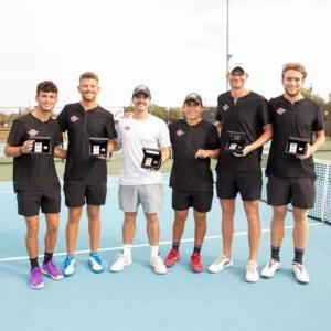 The HSU men's tennis team poses with awards.